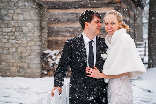 bride and groom in snow